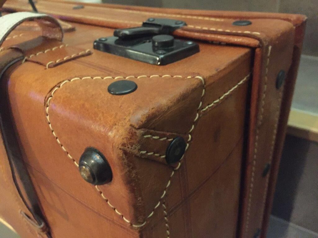 Thick leather suitcase