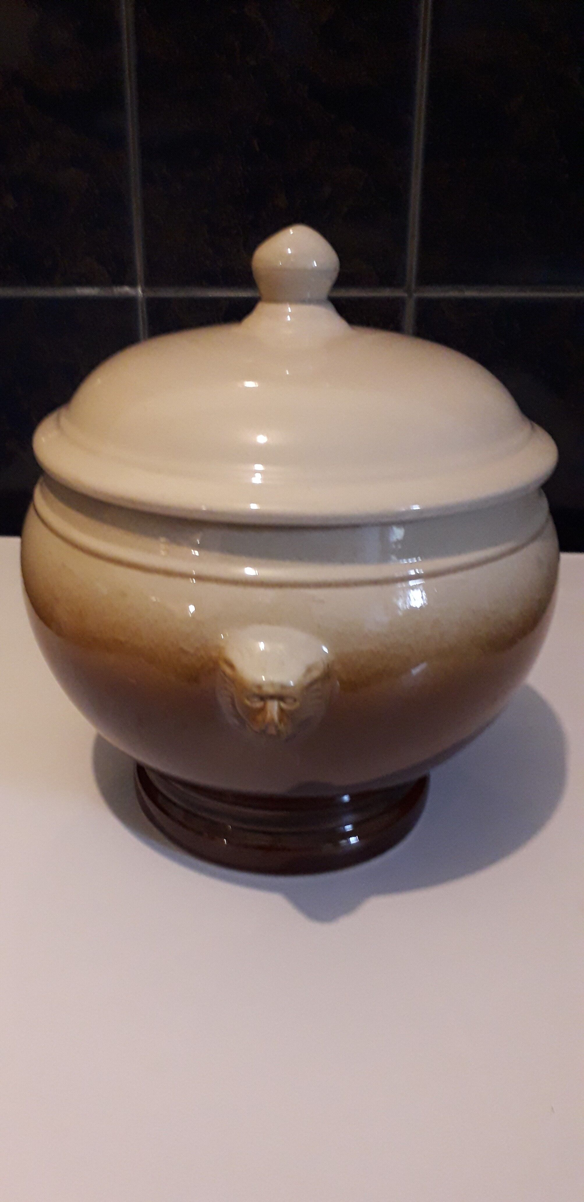 Large covered two-tone ceramic soup bowl with "lion's head" handles