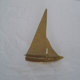 Stylized boat in brass decoration seaside