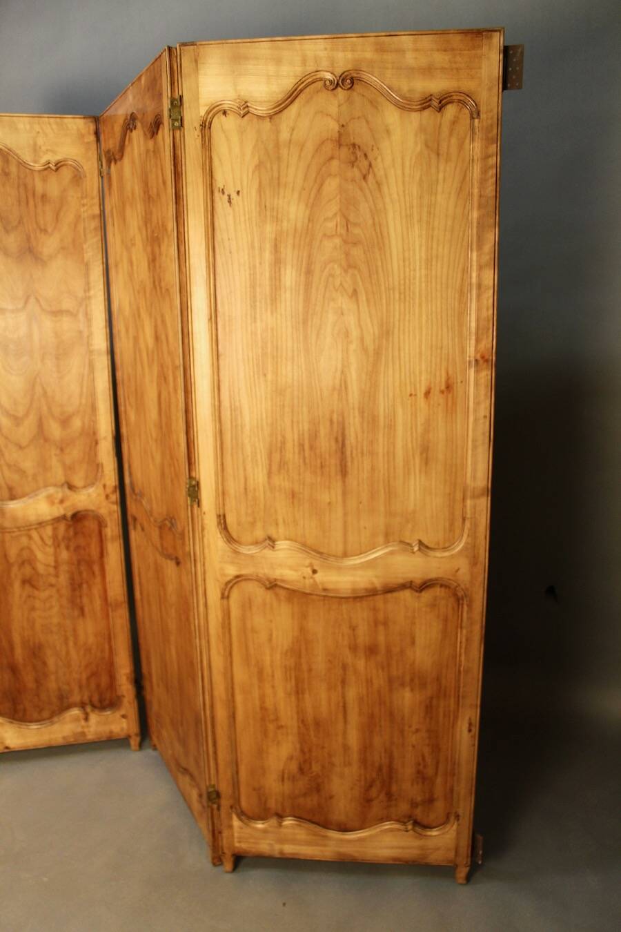 Large cherry wood folding screen with four double-sided panels.