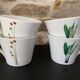 4 fine white porcelain cups with fine flower decoration