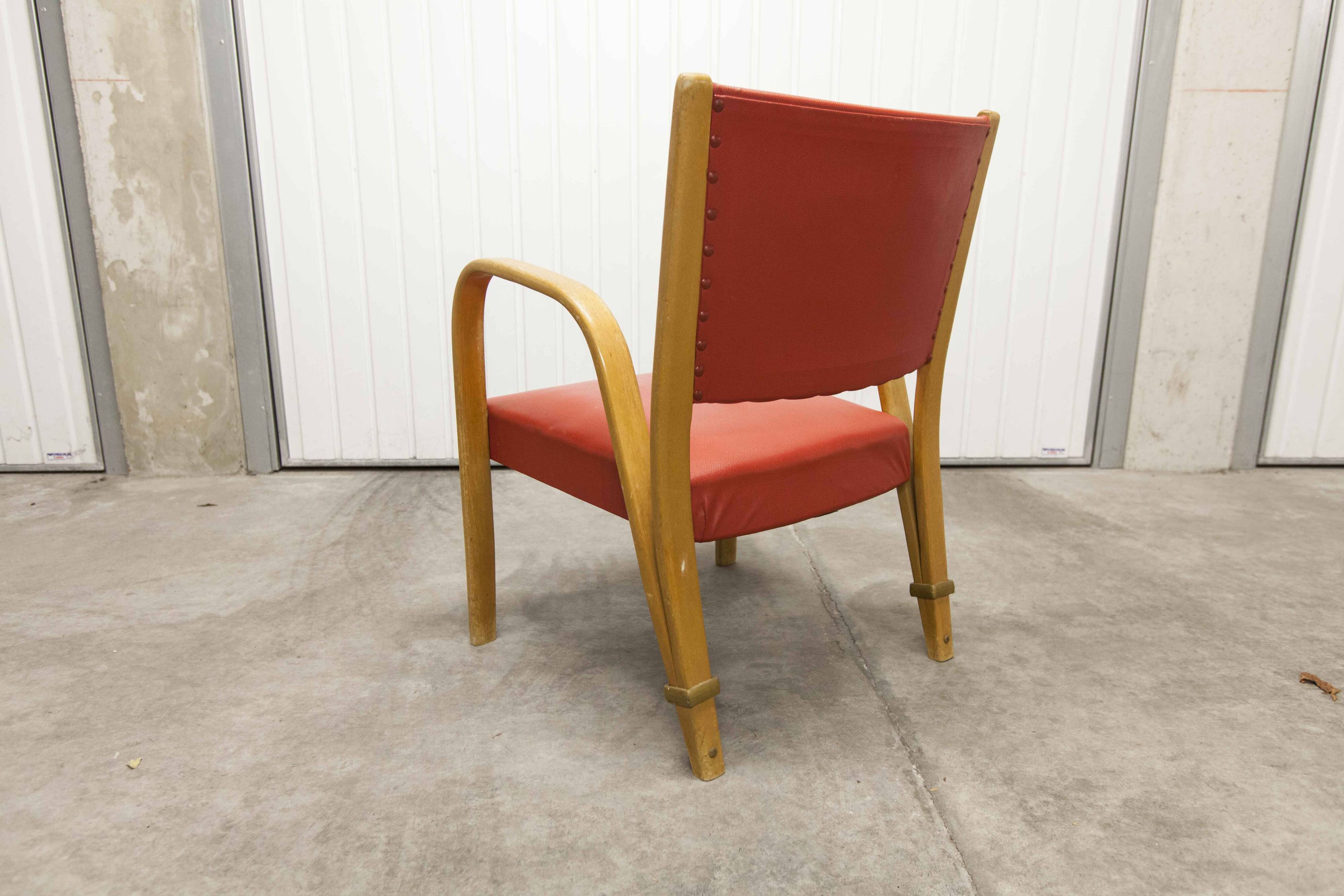 Bow wood armchair by Hugues Steiner 1960 red