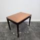 Vintage wooden ottoman from the 1940s with a silk top and studded trim.