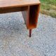 60s desk in golden blond mahogany with conical coffered feet