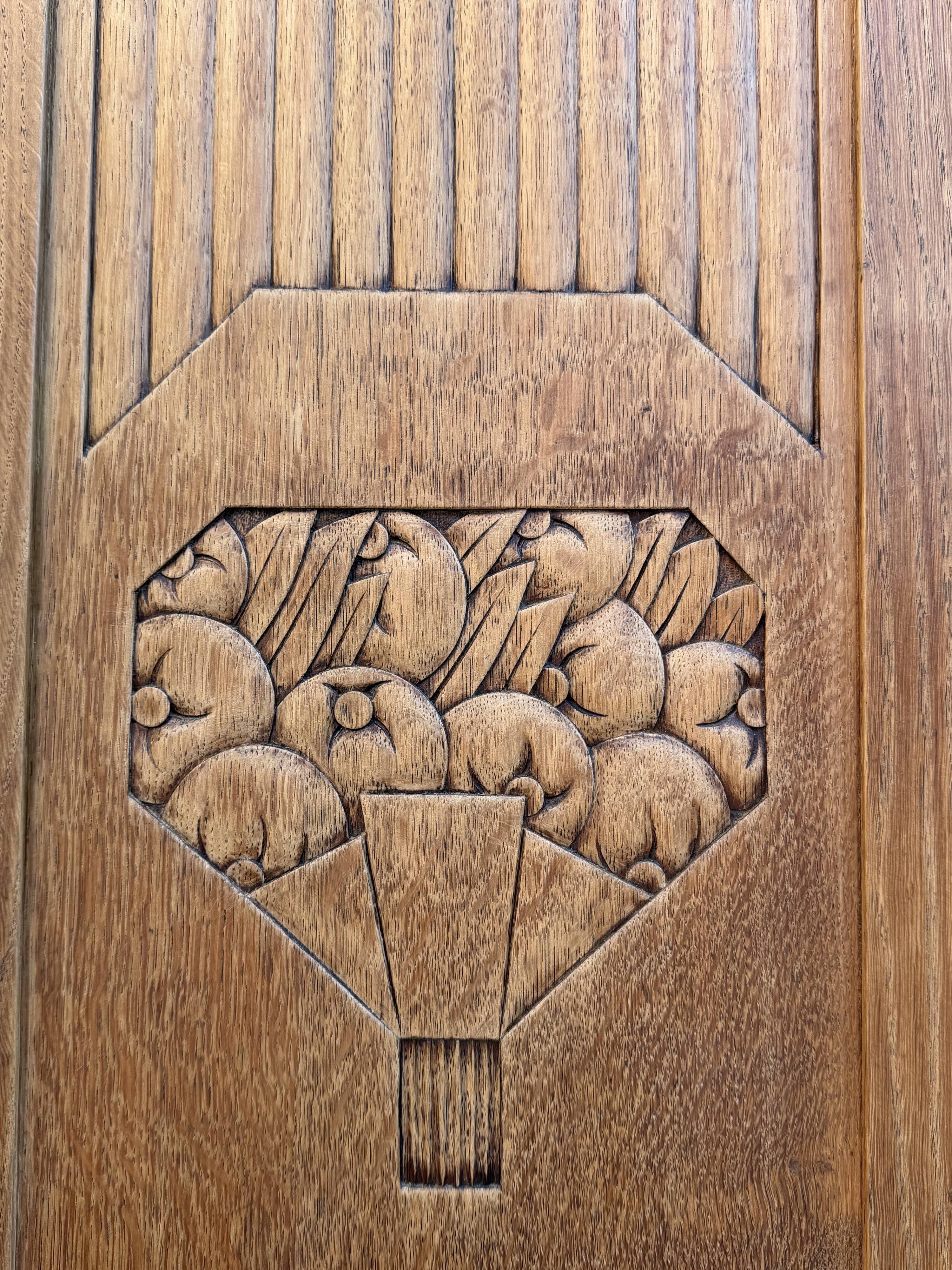 Art deco wardrobe in raw oak with bevelled mirror.