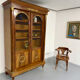 Large Empire-style library in wood with gilded bronze ornaments.