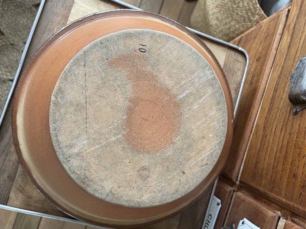 Antique spouted jug in terracotta