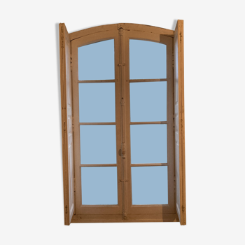 Window with wooden interior shutters