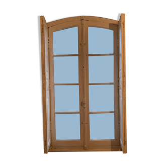 Window with wooden interior shutters