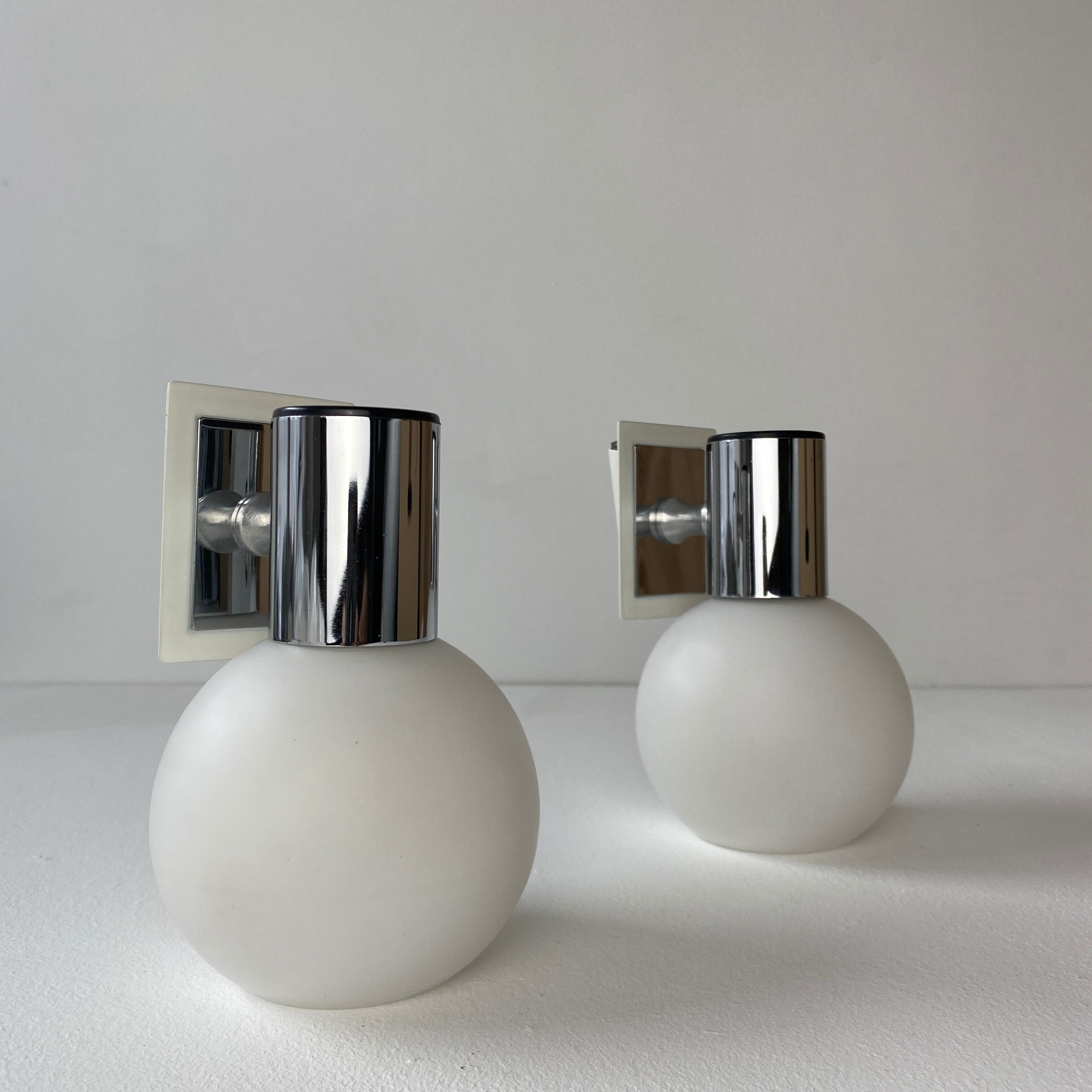 Pair of vintage opaline round wall lamps