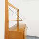 Wall shelf library with vintage light wood secretary bar