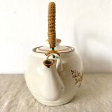 Vintage porcelain and rattan teapot