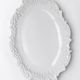 Antique deep dish in white Limoges porcelain, with rockwork relief.