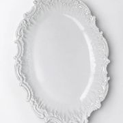 Antique deep dish in white Limoges porcelain, with rockwork relief.