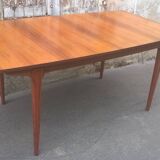 Extendable teak dining table