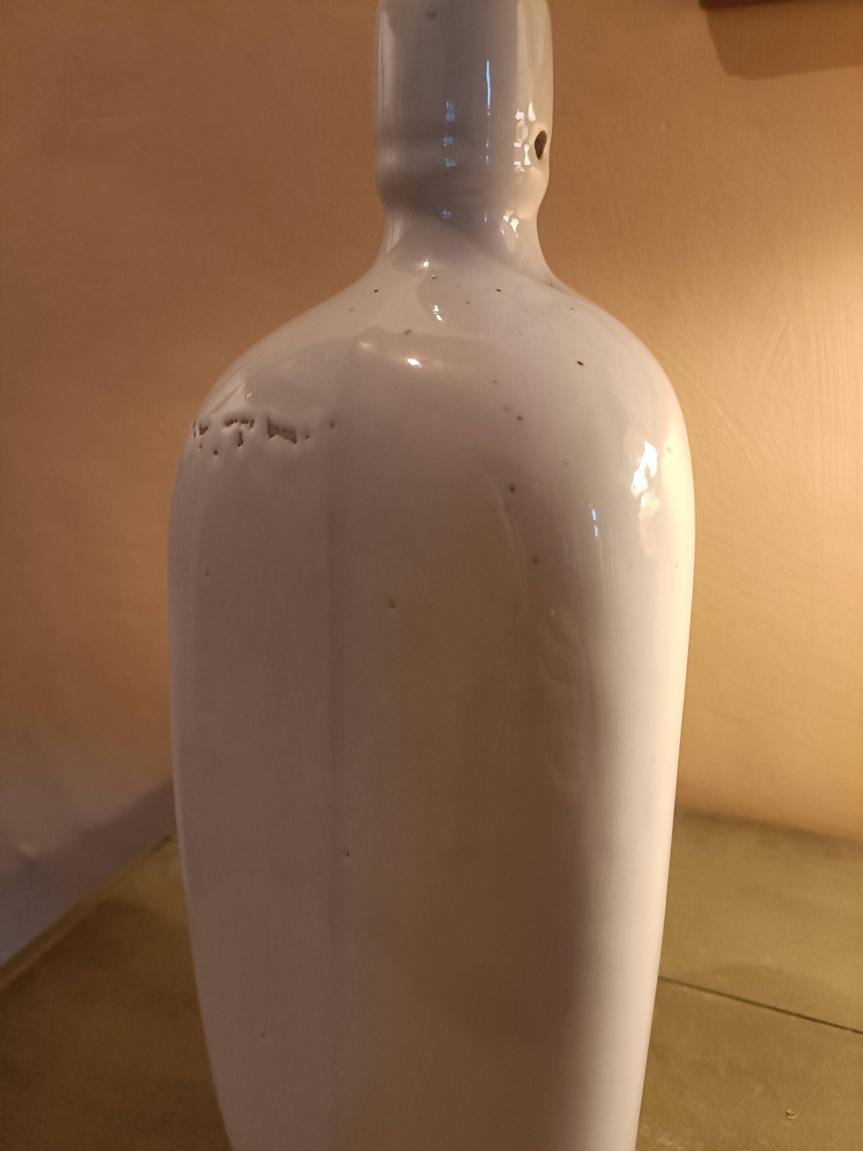 Triangular stoneware bottle