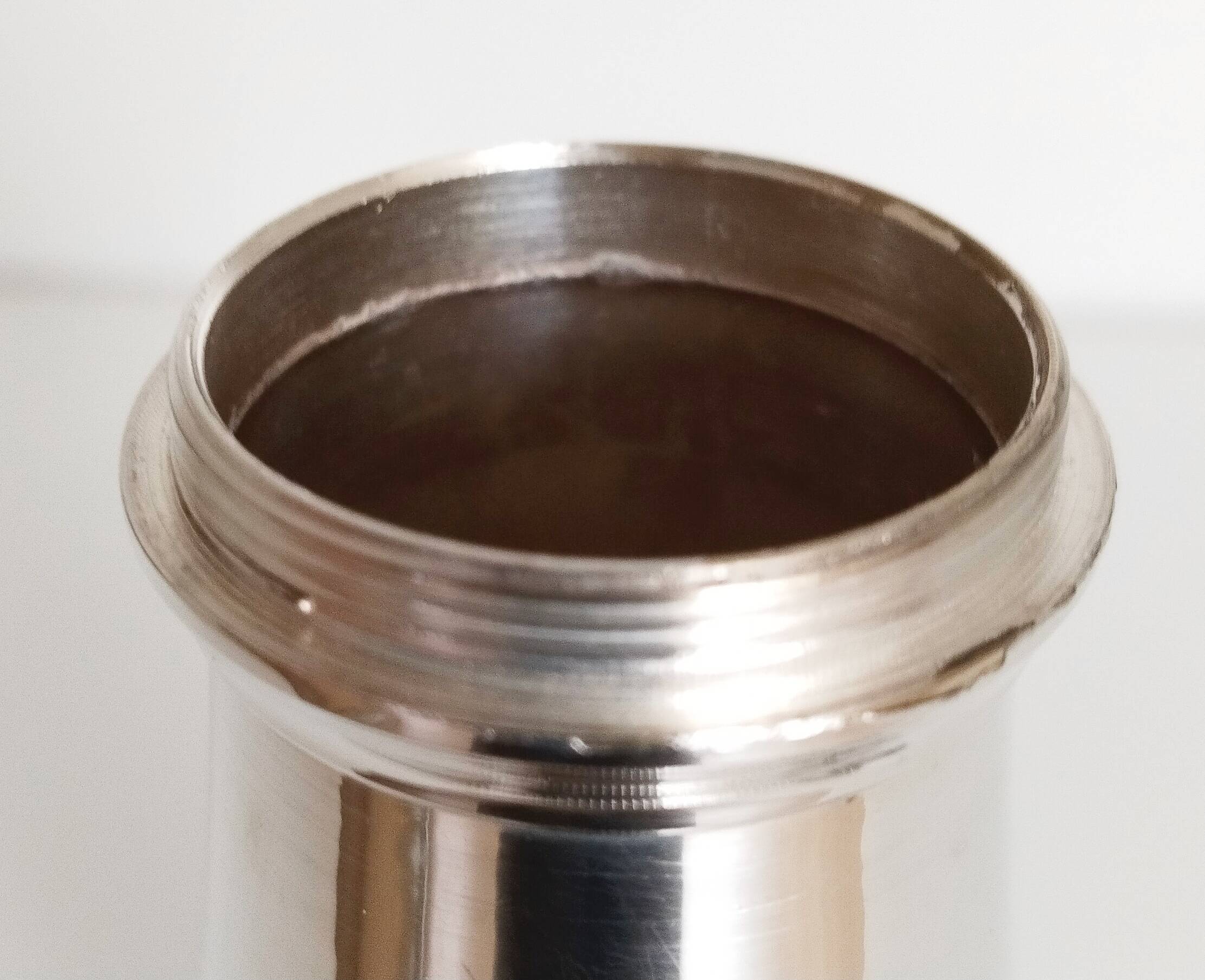 Silver-plated sugar shaker with fluted edges