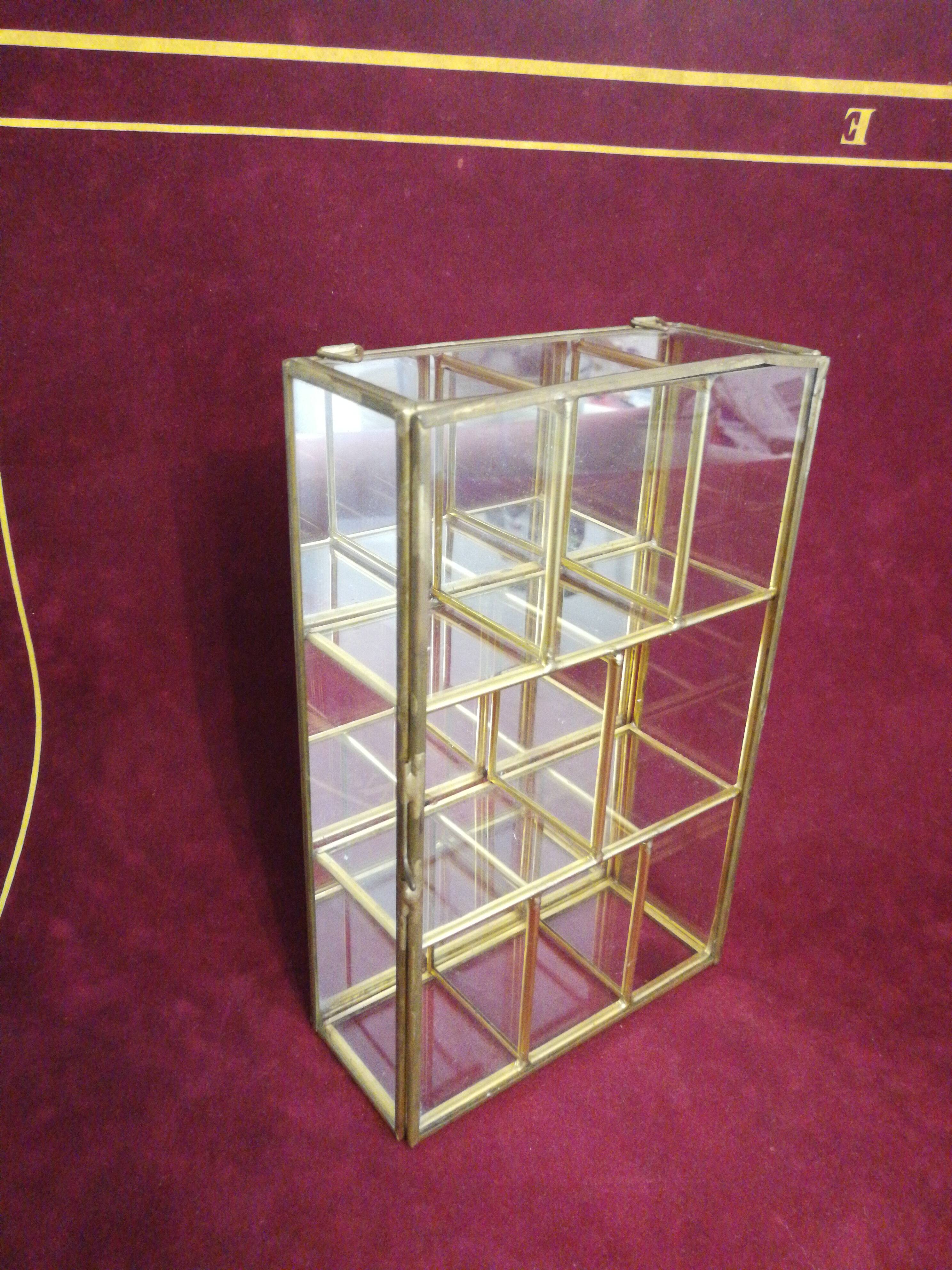 Small brass and glass display case.