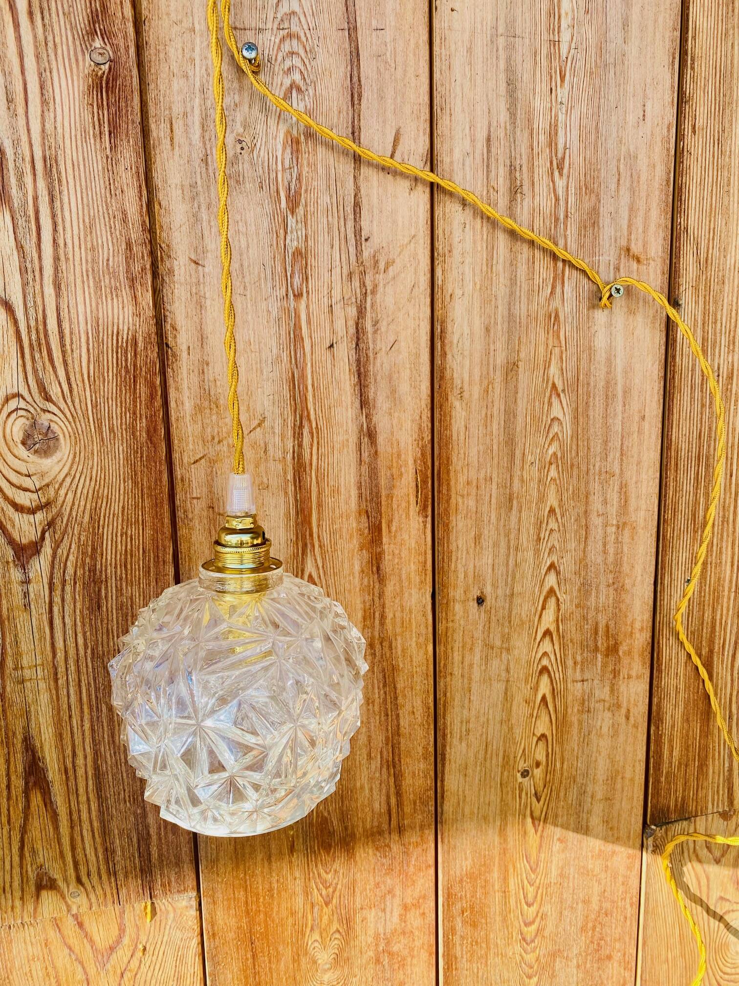 Globe pendant light in chiseled glass