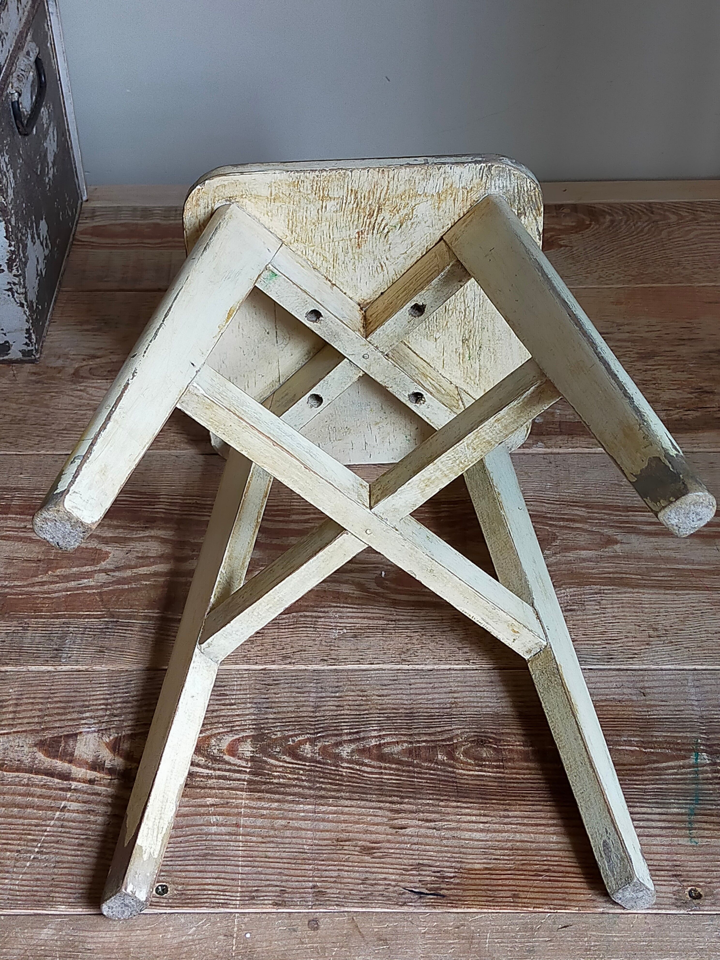 Old workshop stool in patinated solid wood