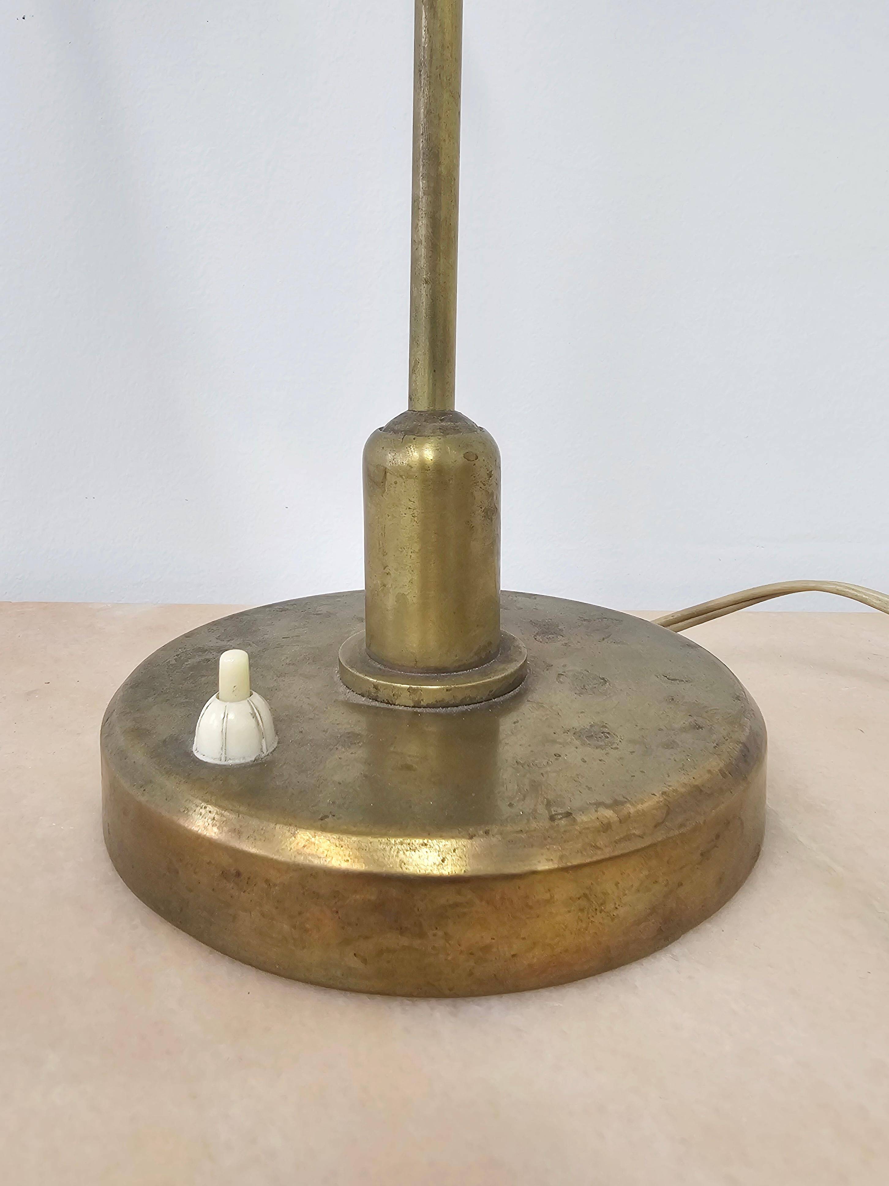 Mid-Century table lamp with a conical metal shade, attributed to Stilnovo.