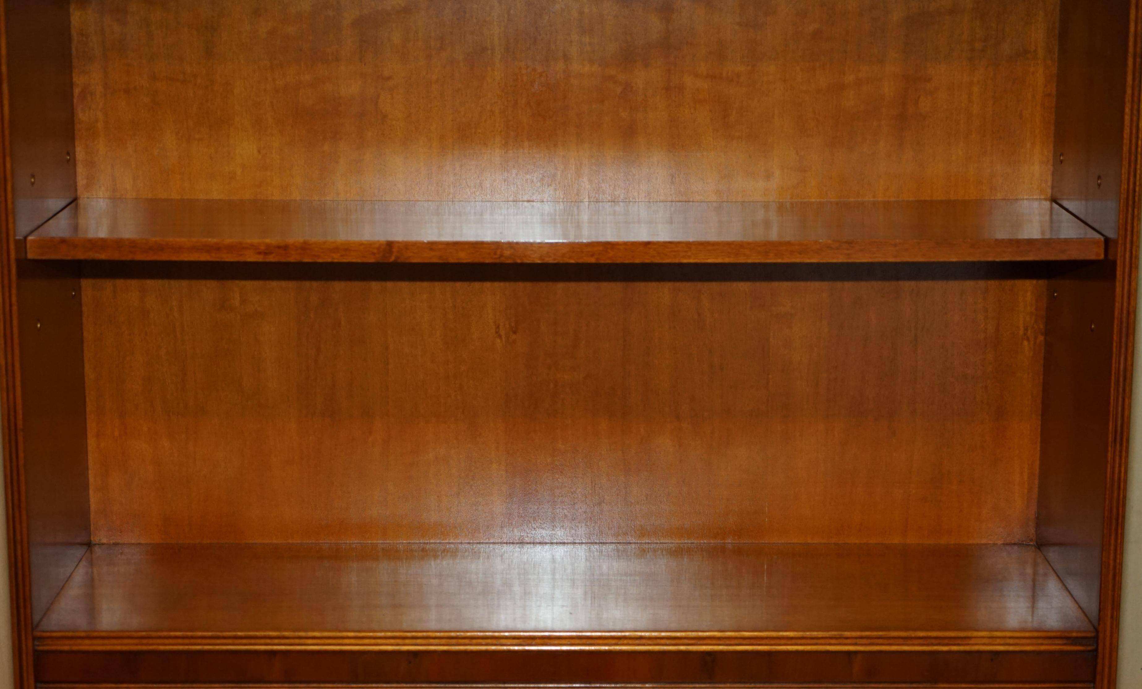Open library Bradley Furniture made of yew wood with a cupboard base.