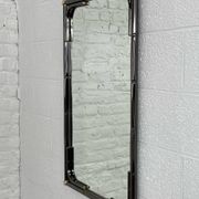 Mirror in black metal and brass with gunmetal finish