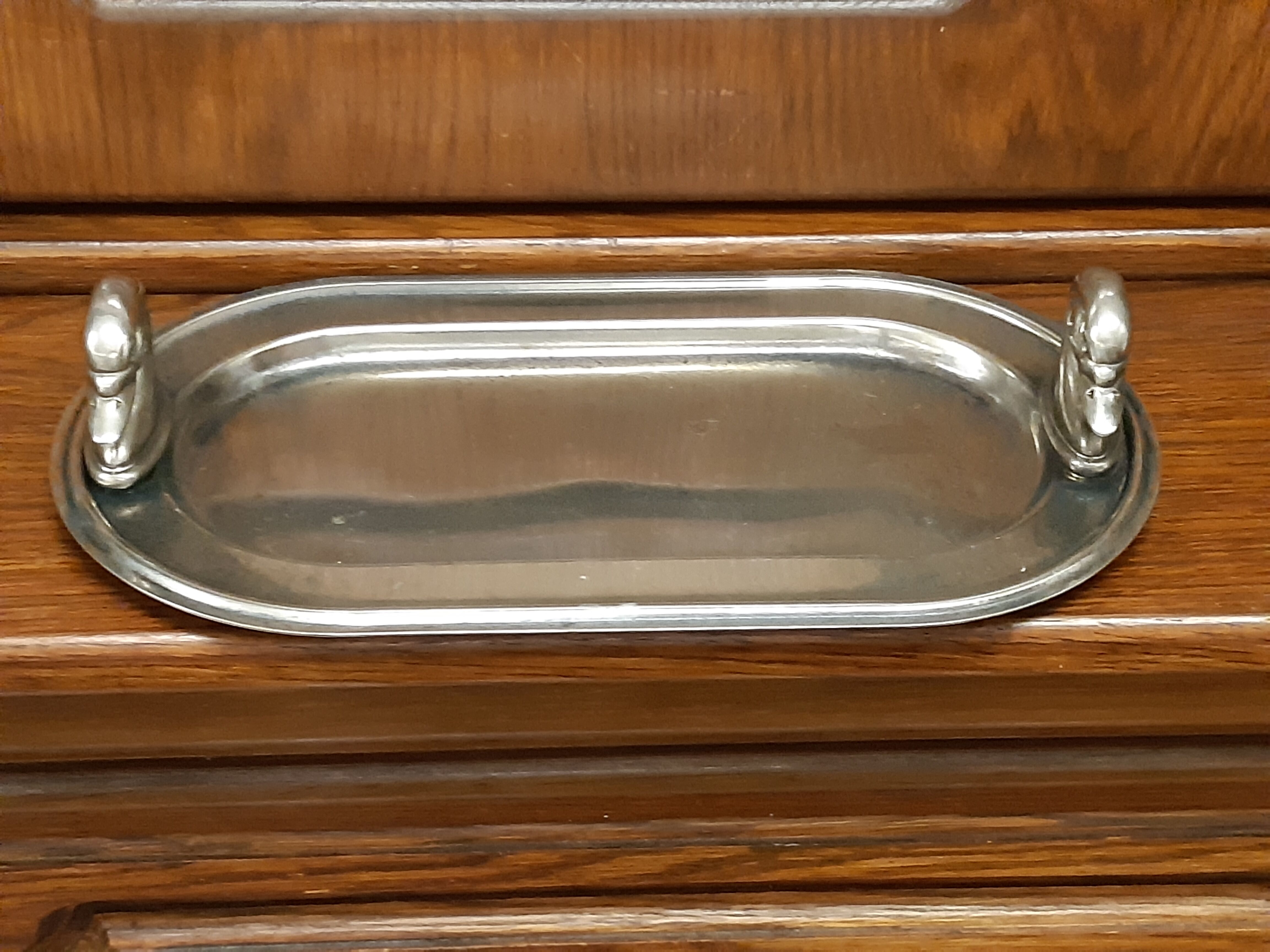 Silver dish with foie gras, duck heads