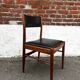 Set of 2 vintage Scandinavian chairs in wood and black faux leather.
