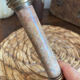 Pair of brass and stone candlesticks