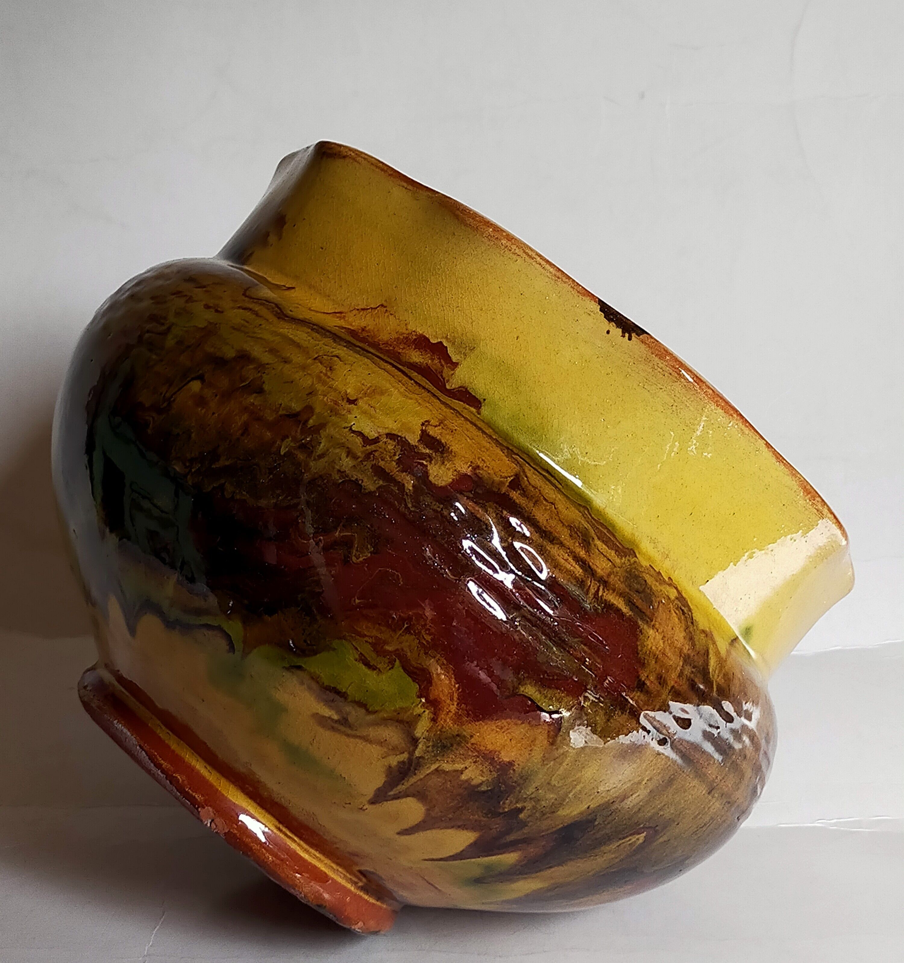 Old provencal pot cover in glazed terracotta