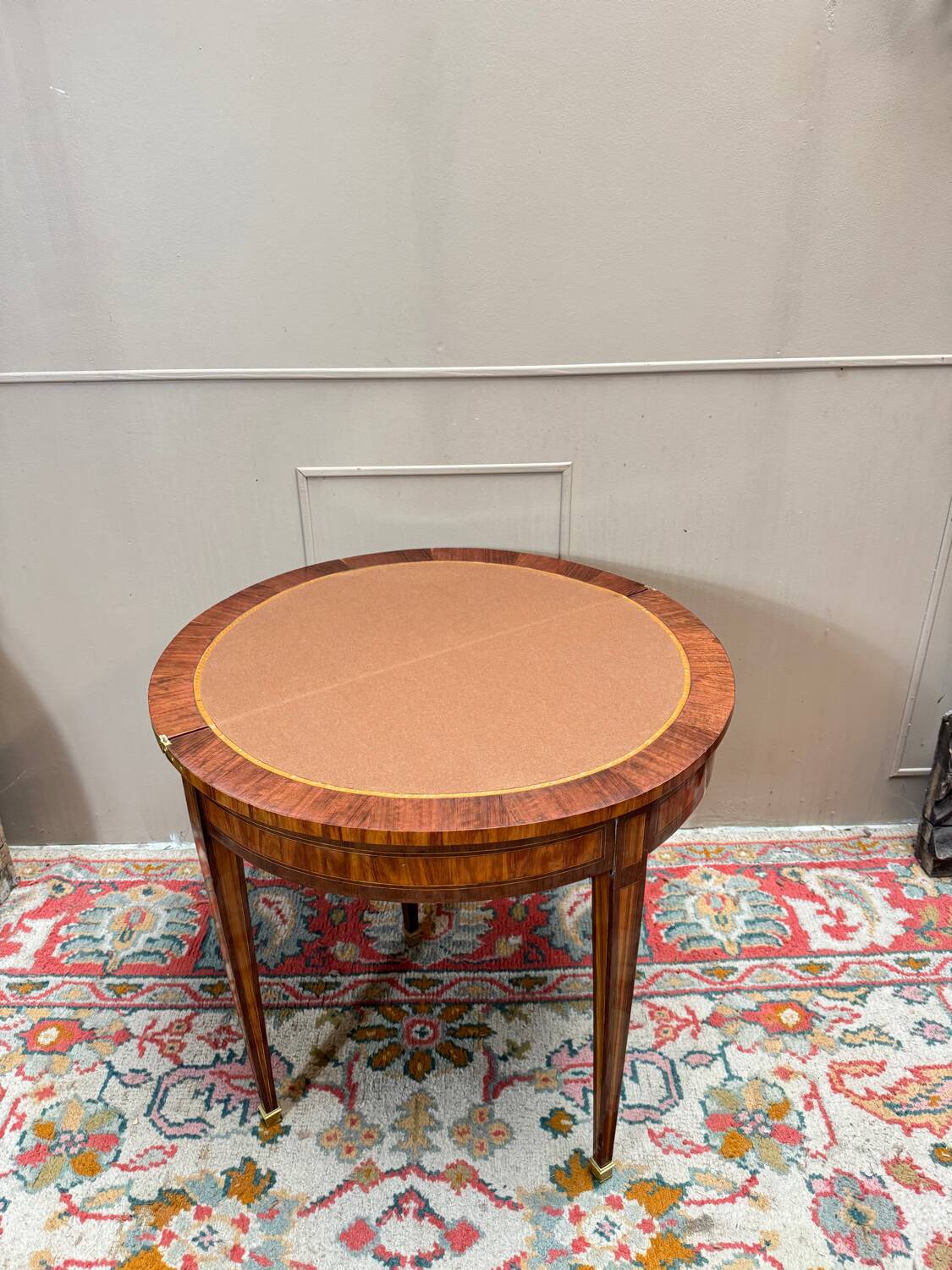 Half-moon game table in marquetry from the Louis XVI period, 18th century.