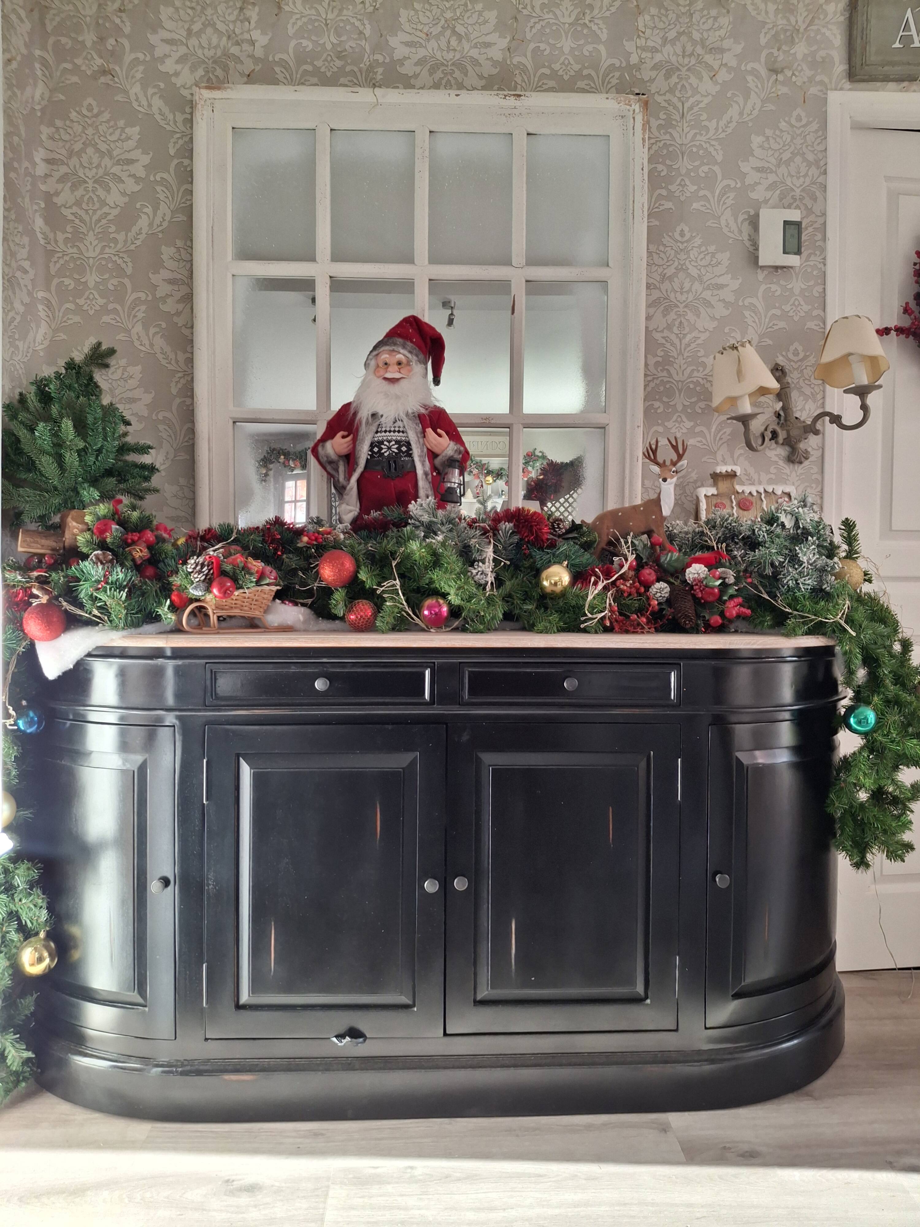 Black sideboard with curved sides and wooden top