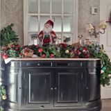 Black sideboard with curved sides and wooden top