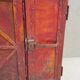 Old atypical metal workshop furniture with its original red patina