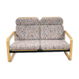 Vintage sofa with fabric and wooden frame