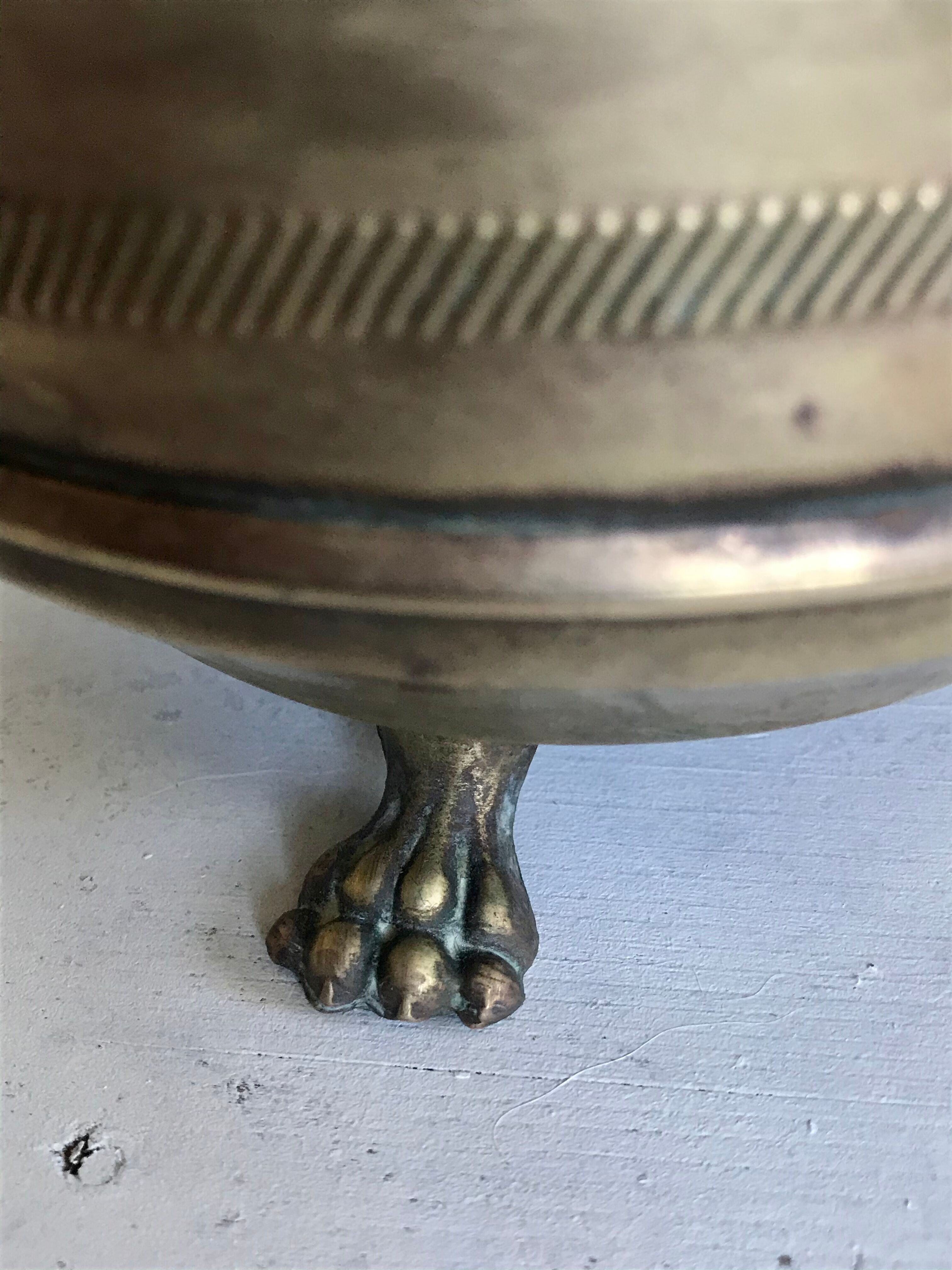 Former brass tripod pot