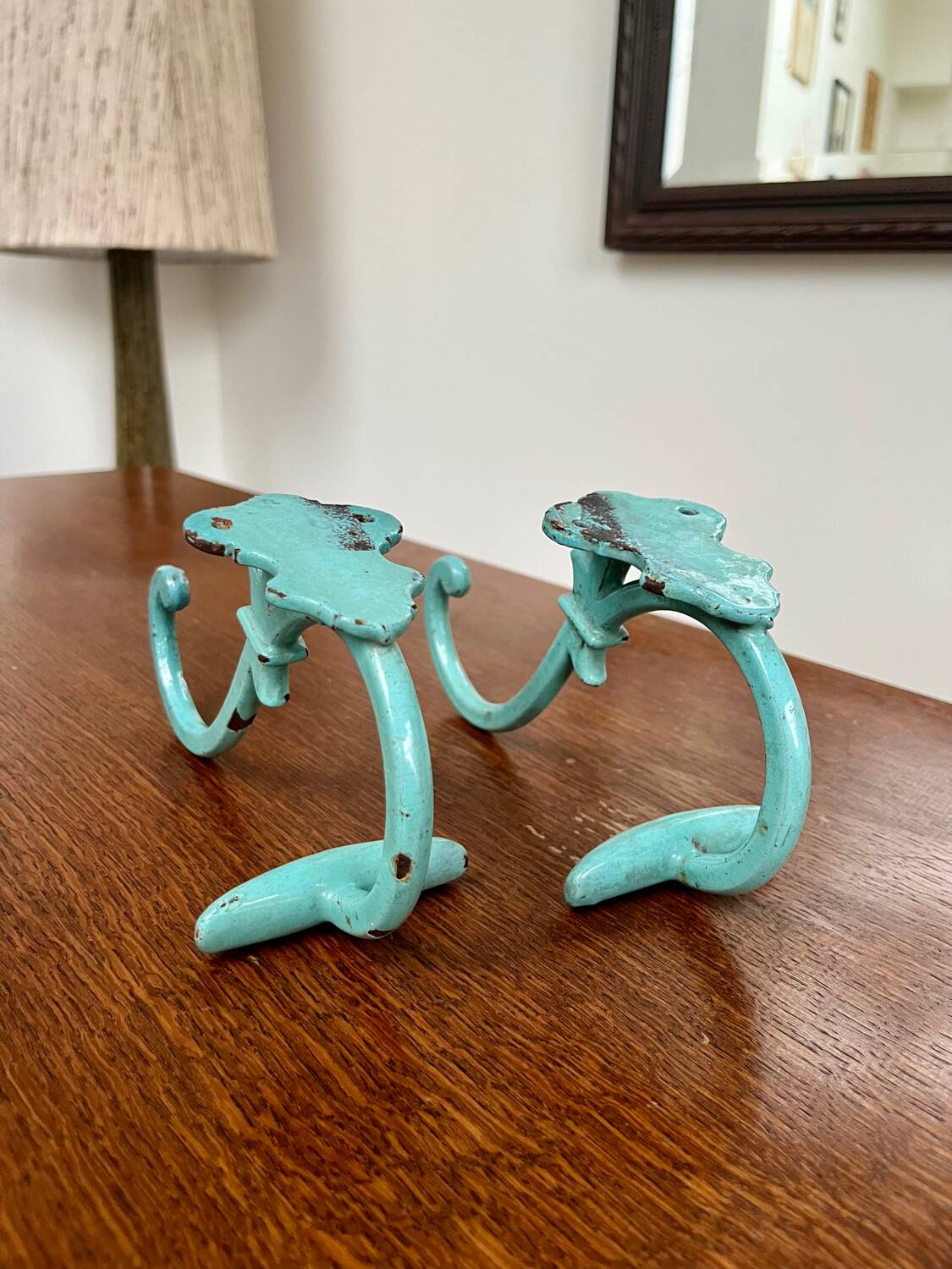 Pair of painted metal wall hooks