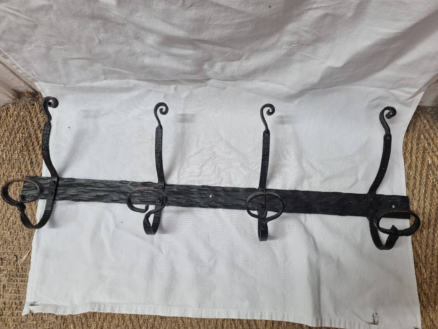 Coat rack with 4 iron coat hooks