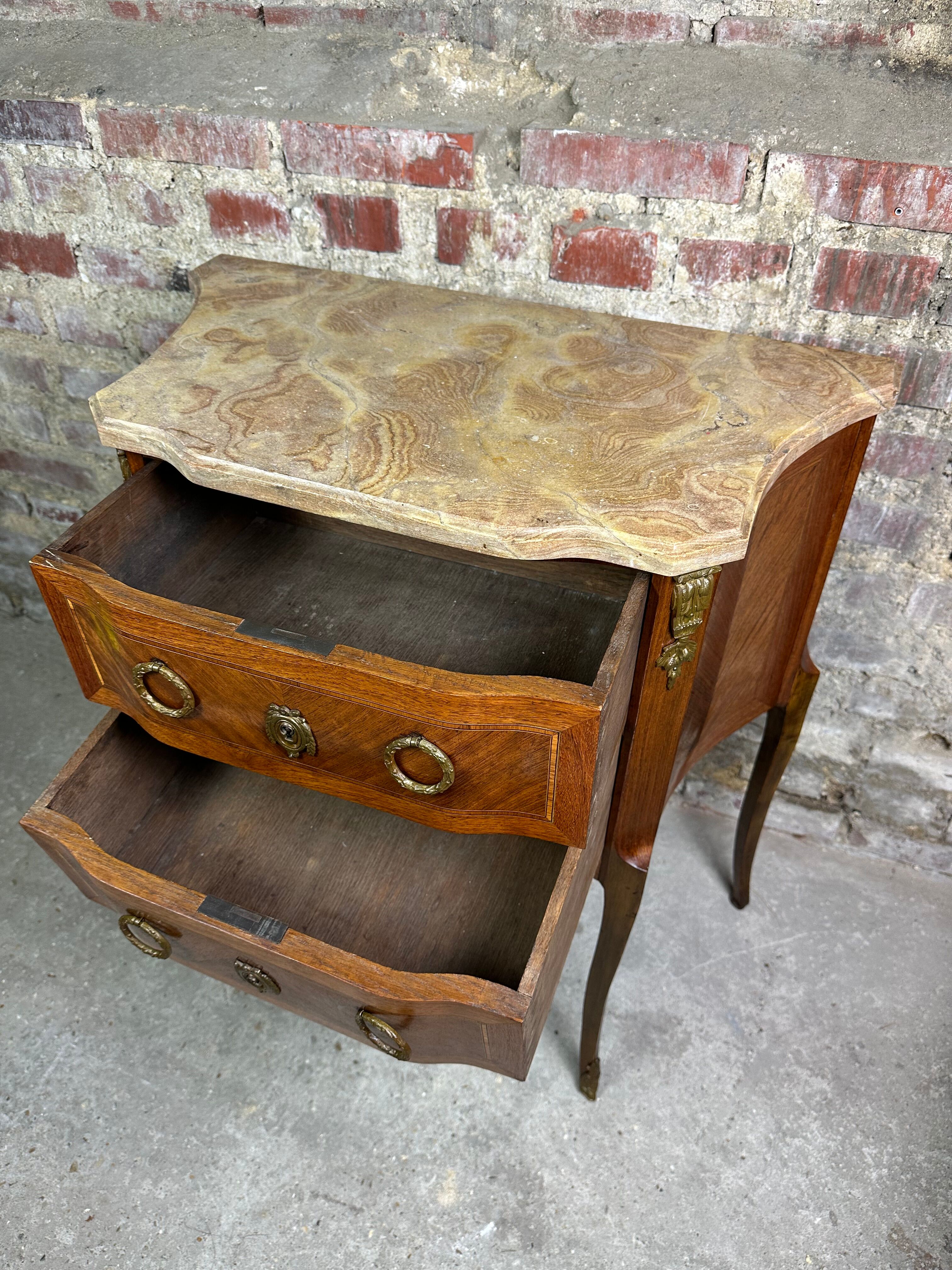 Louis XV/XVI transition style curved chest of drawers in marquetry and bronze