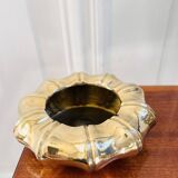 Golden brass ashtray with bamboo decoration.