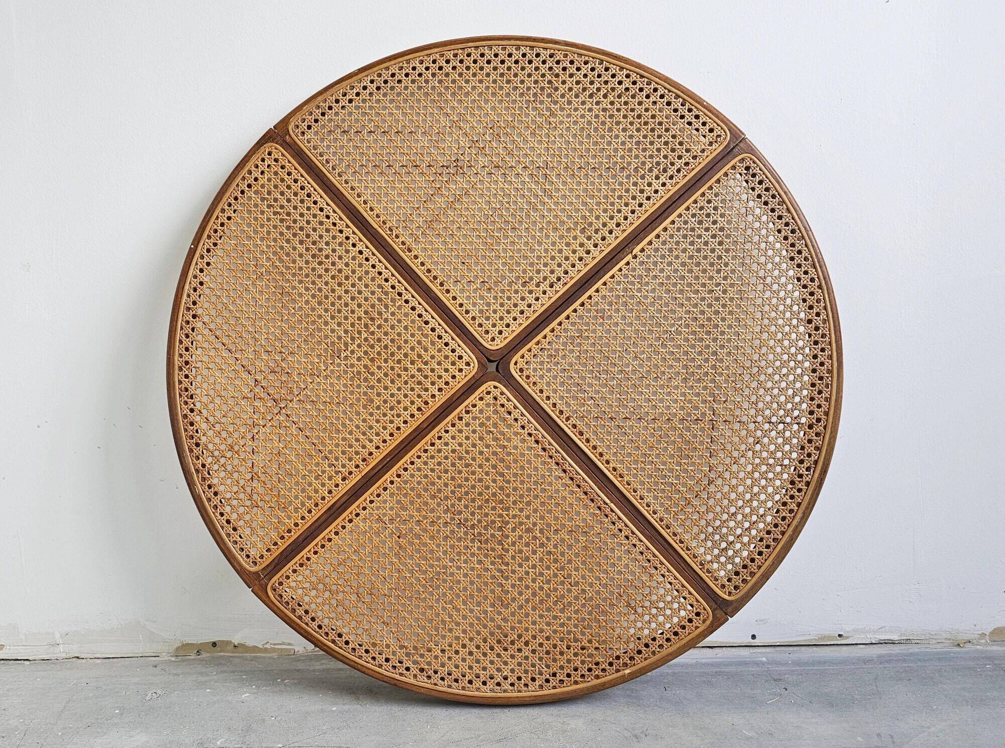 Round dining table in curved wood with a rattan top by Mundus, 1960s.