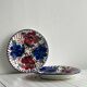 Pair of decorative ceramic plates with floral motifs.