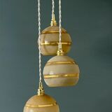 Suspension triple vintage glass globes in frosted yellow and gold.
