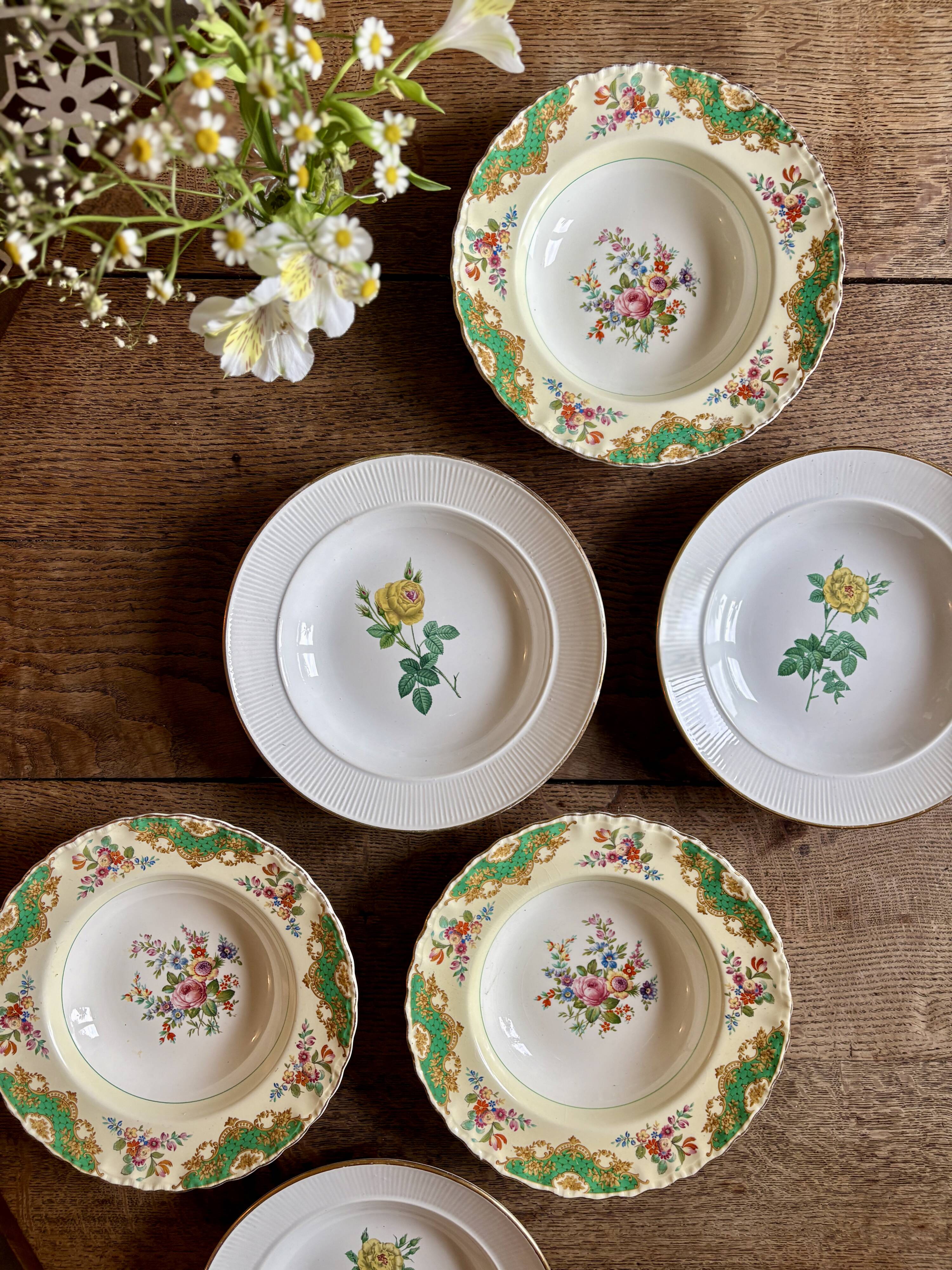 Set of 6 mismatched antique deep plates.