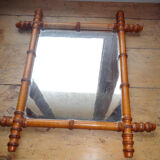 Mirror to the wooden frame imitating bamboo