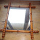 Mirror to the wooden frame imitating bamboo
