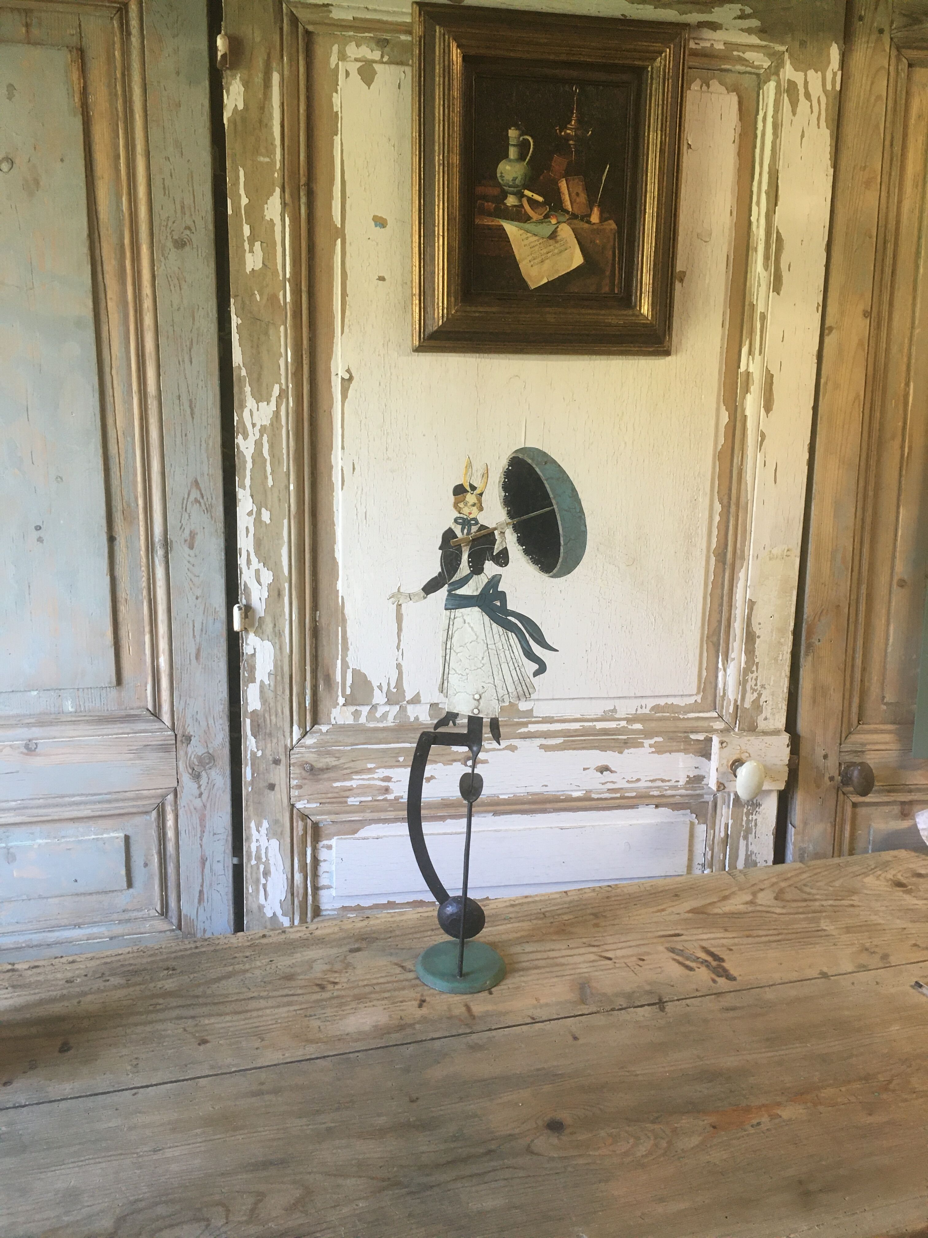 Woman with metal umbrella, pendulum