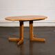 Oval dining table with 2 extensions.
