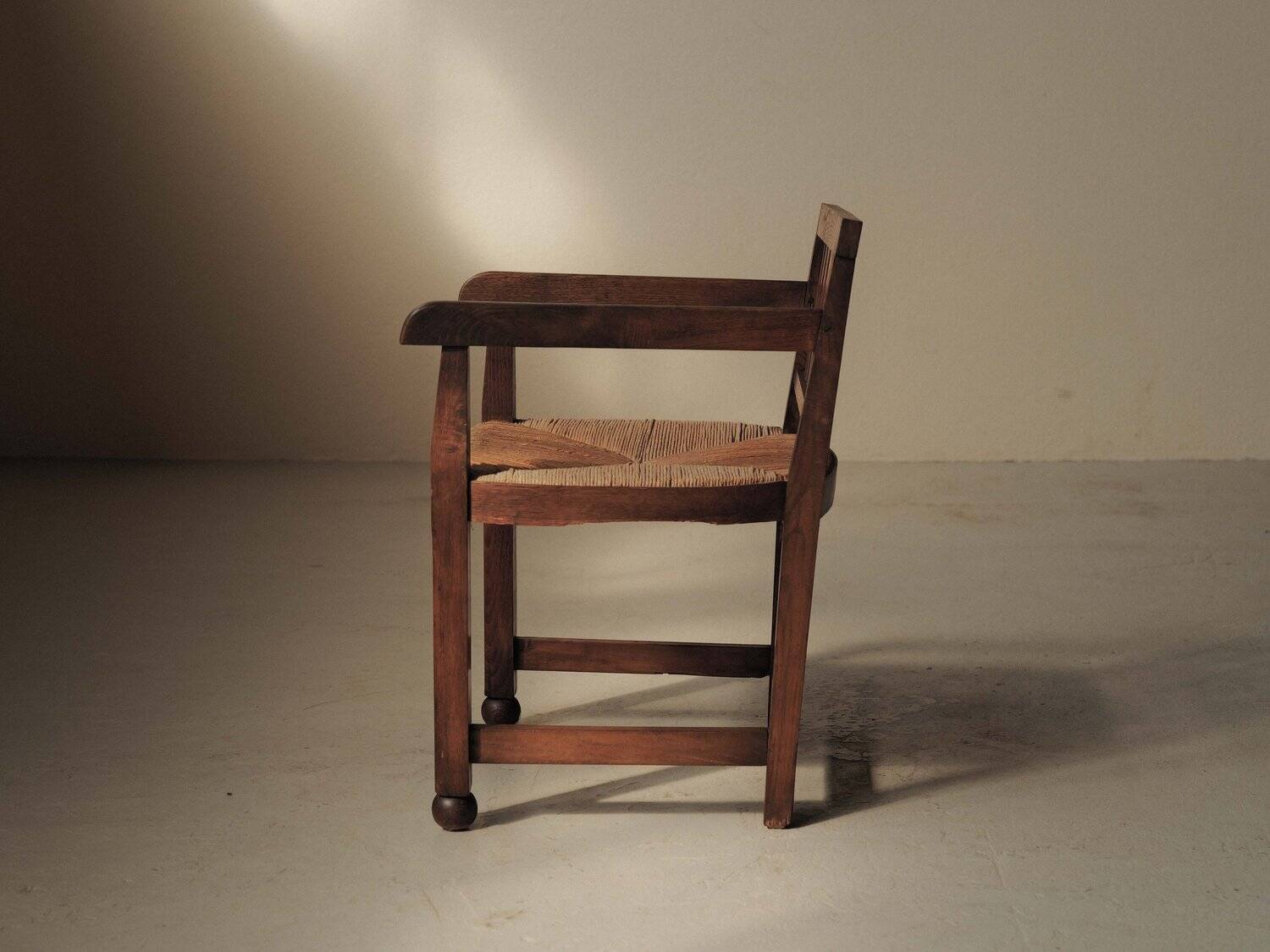 Handcrafted oak and straw armchair, France, circa 1950.